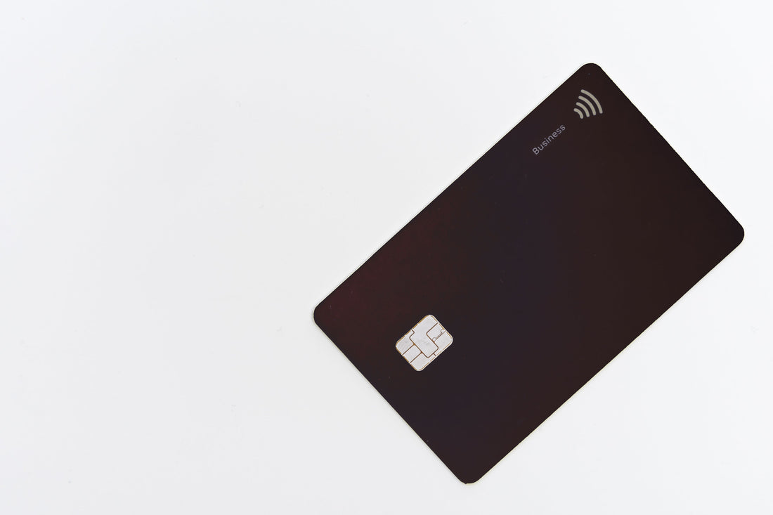 black-plastic-debit-card-on-a-white-table.jpg